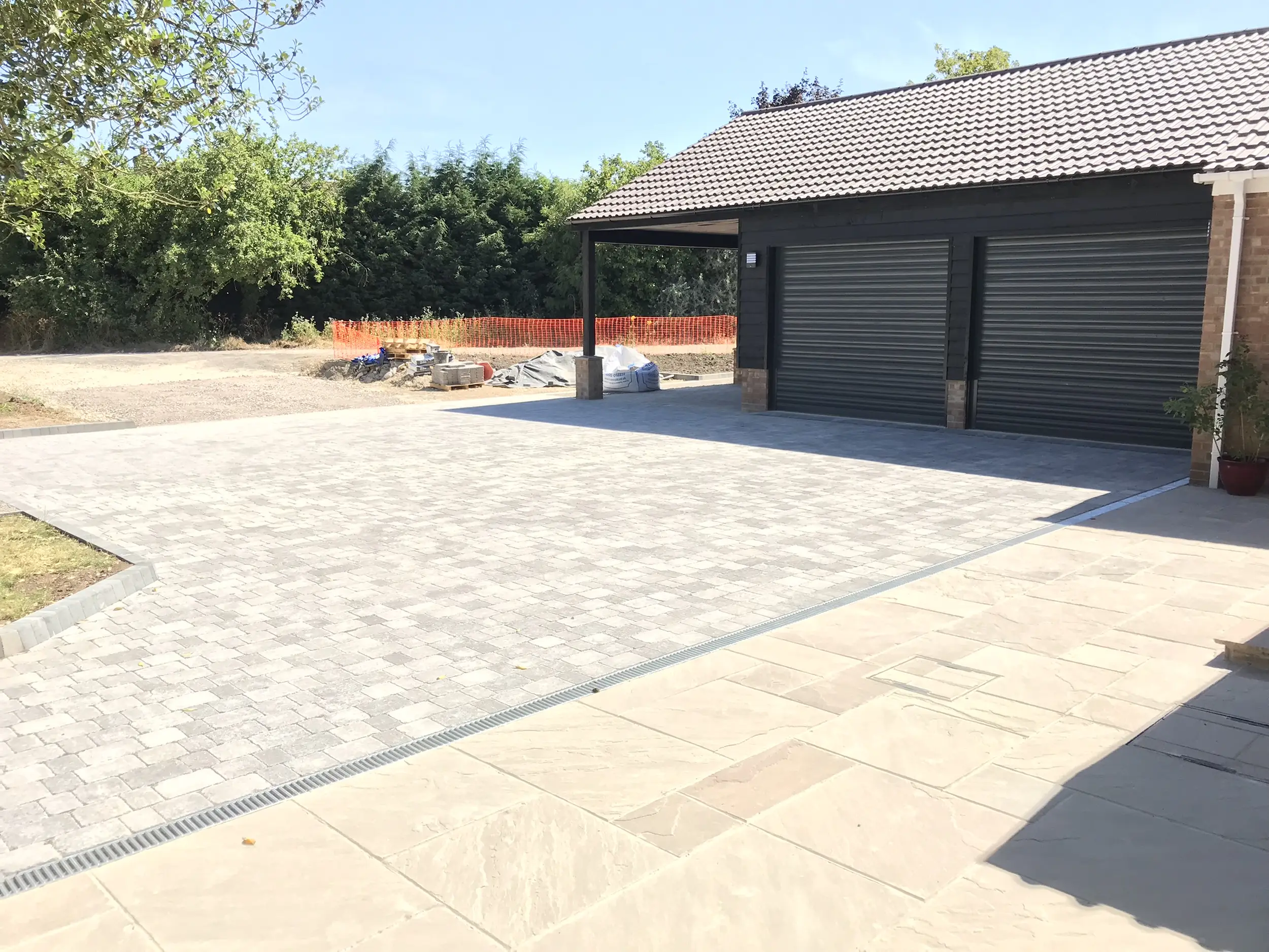Large patio and paved driveway area